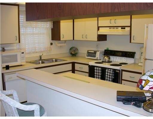 Property Photo: 929 Capri Isles Boulevard 21 FL 34292