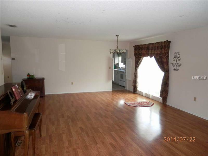 Property Photo:  5104 The Oaks Circle  FL 32809 