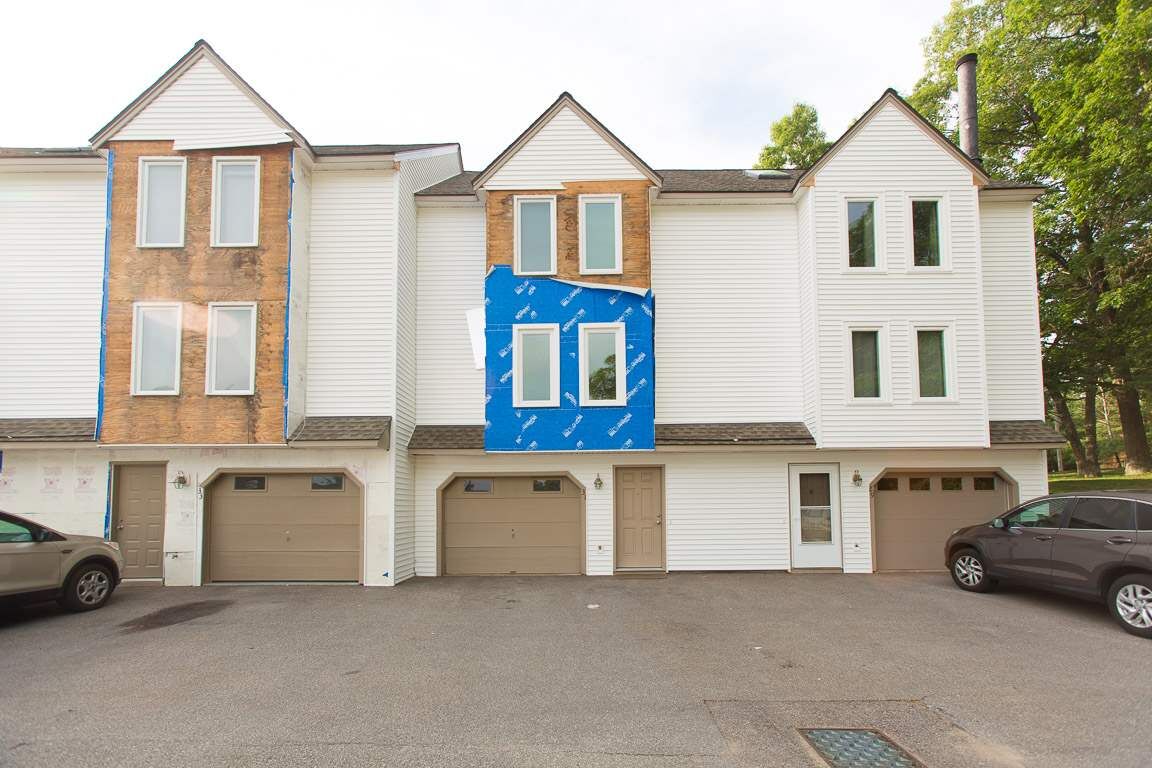 Property Photo: 31 Windermere Way 31 NH 03063