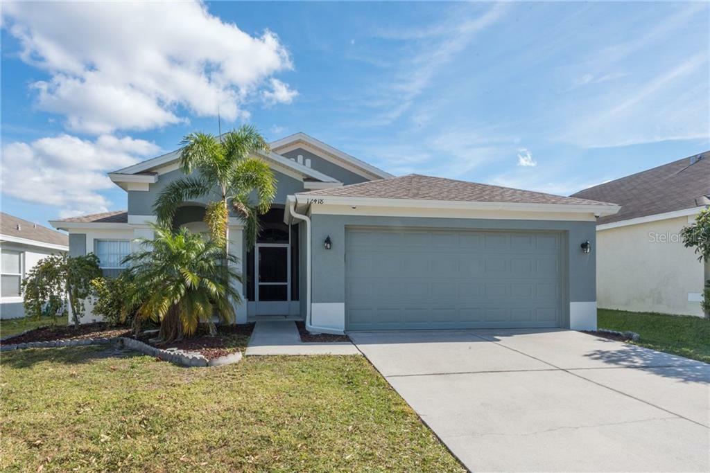 Property Photo:  12418 Midpointe Drive  FL 33578 