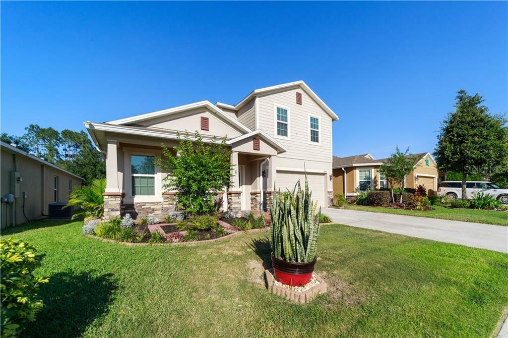 Property Photo:  5944 Windsong Oak Drive  FL 34748 