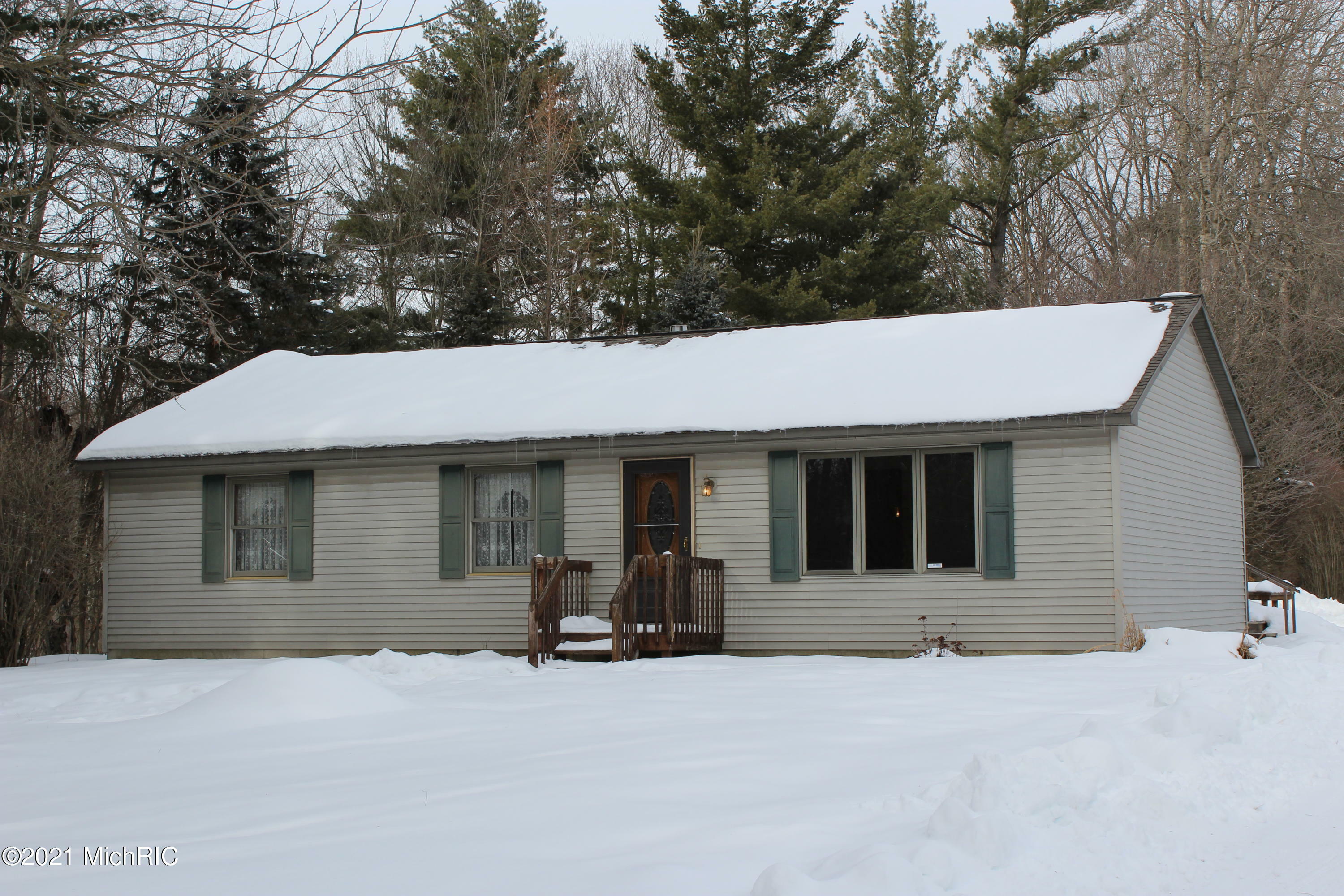 Property Photo:  1616 14 Mile Rd.  MI 49665 