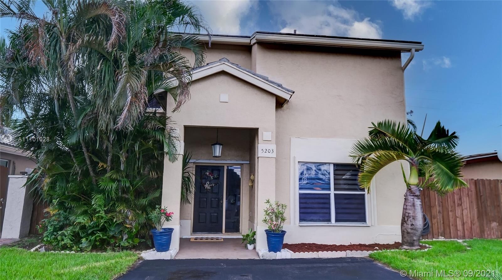 Property Photo: 5203 NW 187th St FL 33055