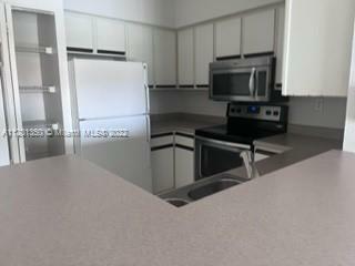 Property Photo:  160 SW 117th Ter 6305  FL 33025 