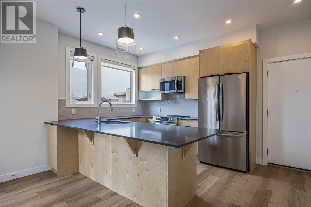 Property Photo:  209 Stewart Creek Rise  AB T1W0N9 