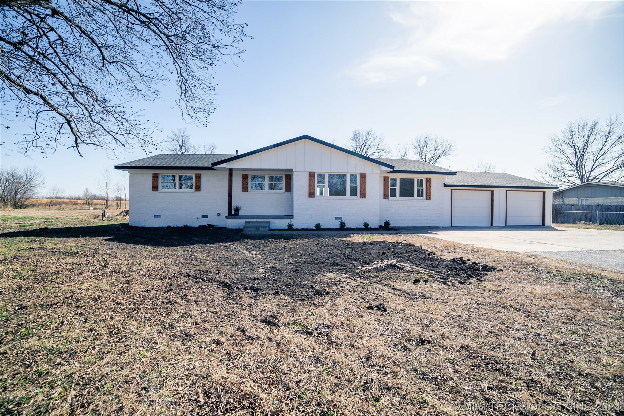 Property Photo:  6214 W Rogers Boulevard  OK 74070 