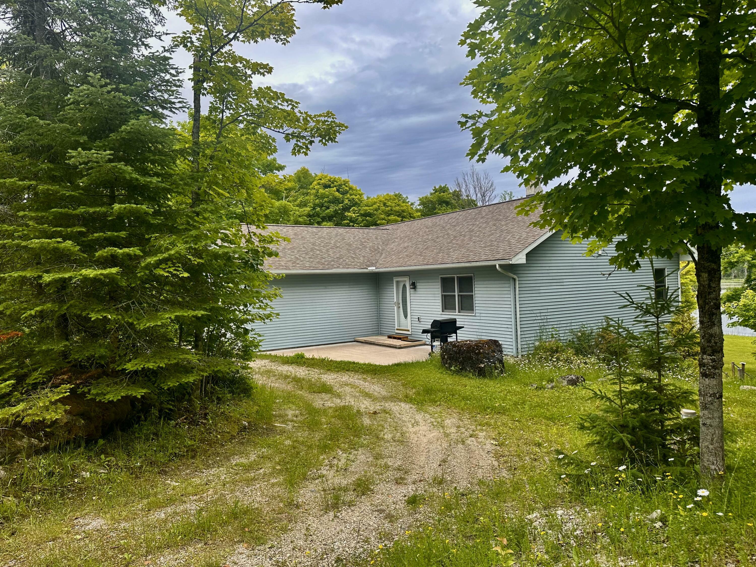 Property Photo:  605 S Hill Island Rd  MI 49719 