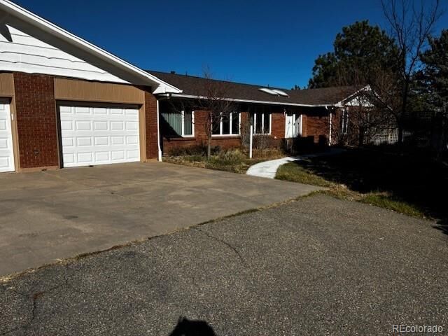 Property Photo:  7846 Village Road  CO 80134 