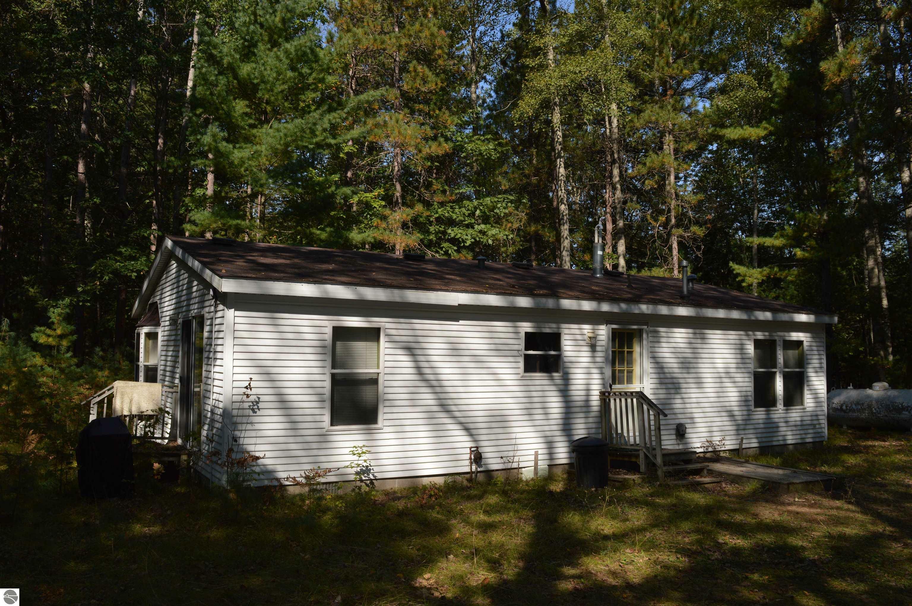 Property Photo:  6188 SW Jesses Trail  MI 49680 