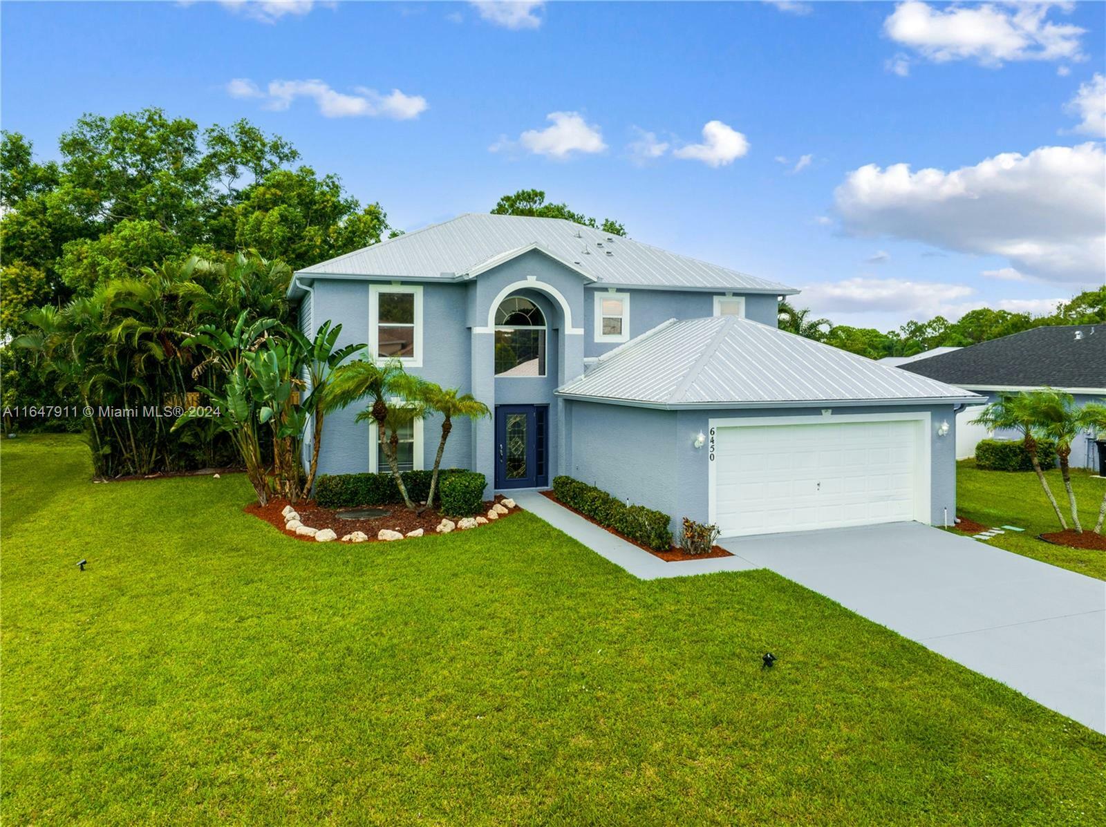 Property Photo:  6450 NW Hacienda Ln  FL 34986 