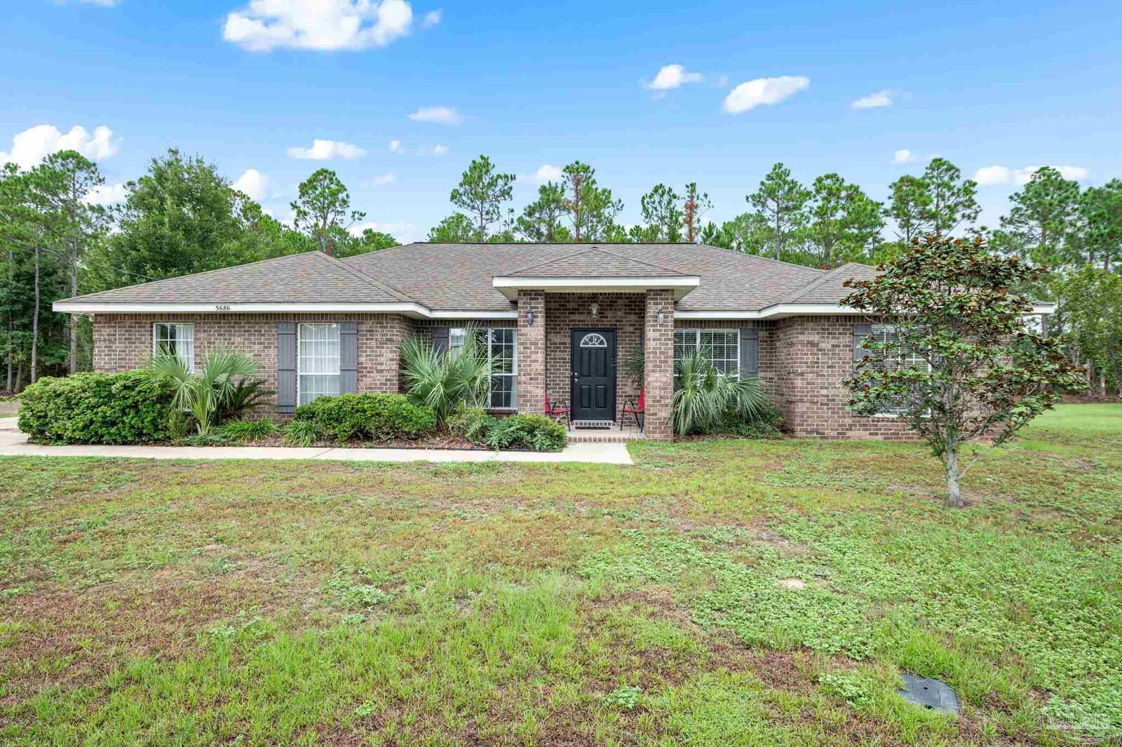 Property Photo: 5686 Farrel Way FL 32583