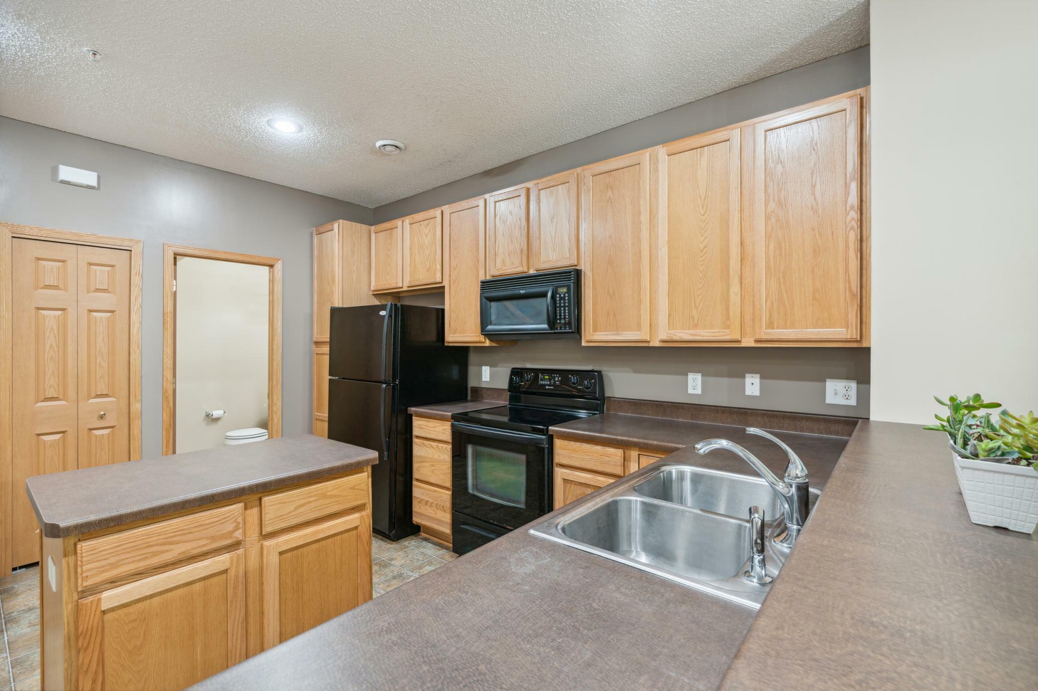 Property Photo:  2450 49th Street E 7302  MN 55076 