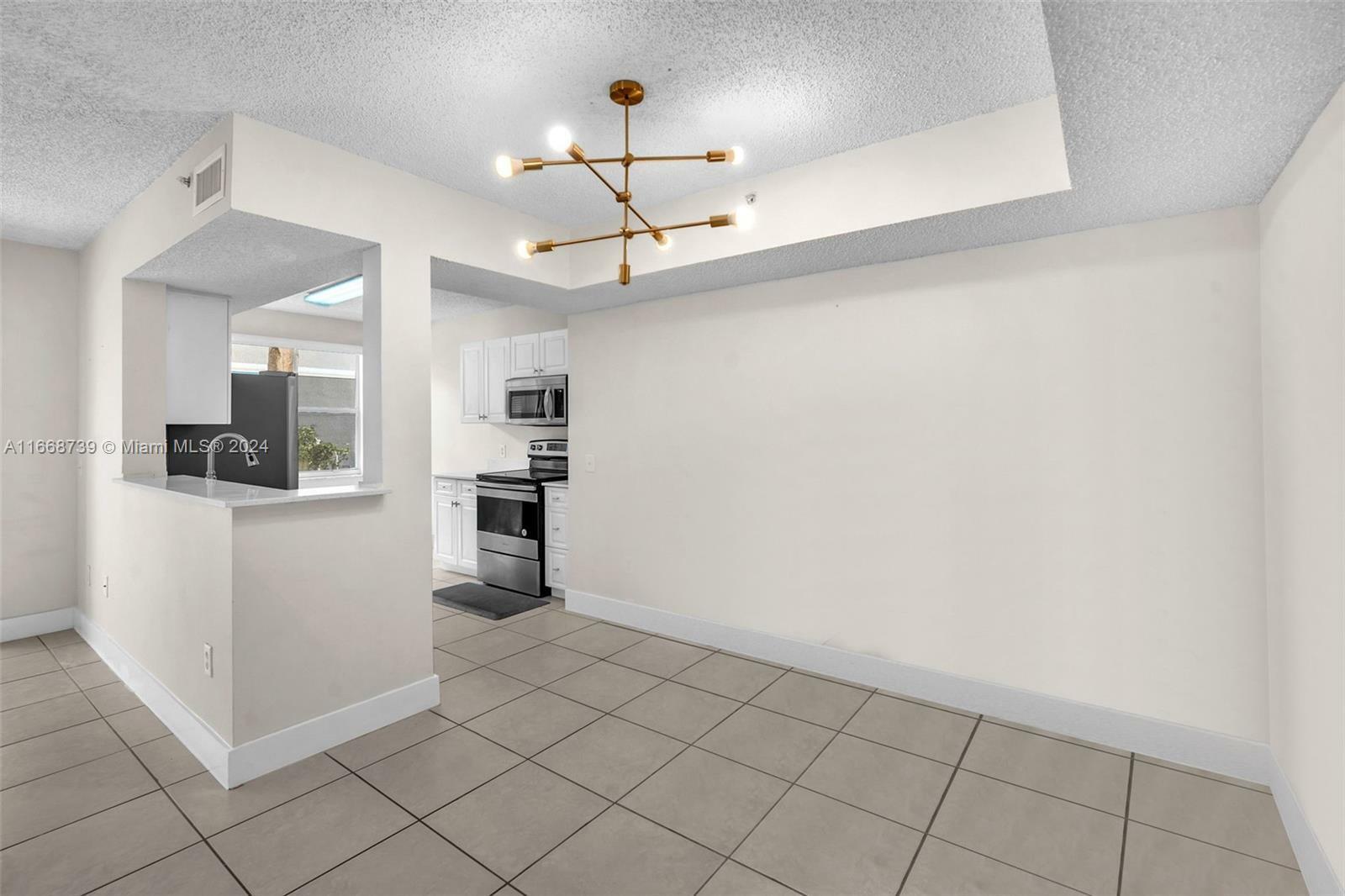 Property Photo:  9610 NW 2nd St 8-102  FL 33024 