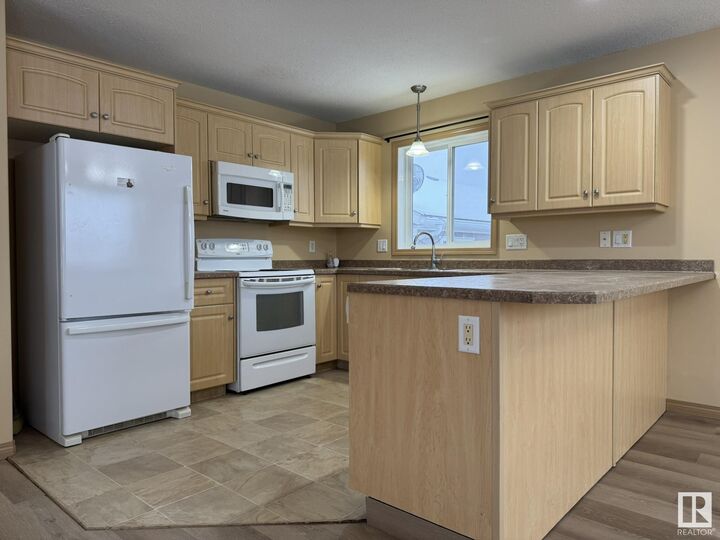 Property Photo: 6404 -47 Street A&Ampb AB T9M 2E5
