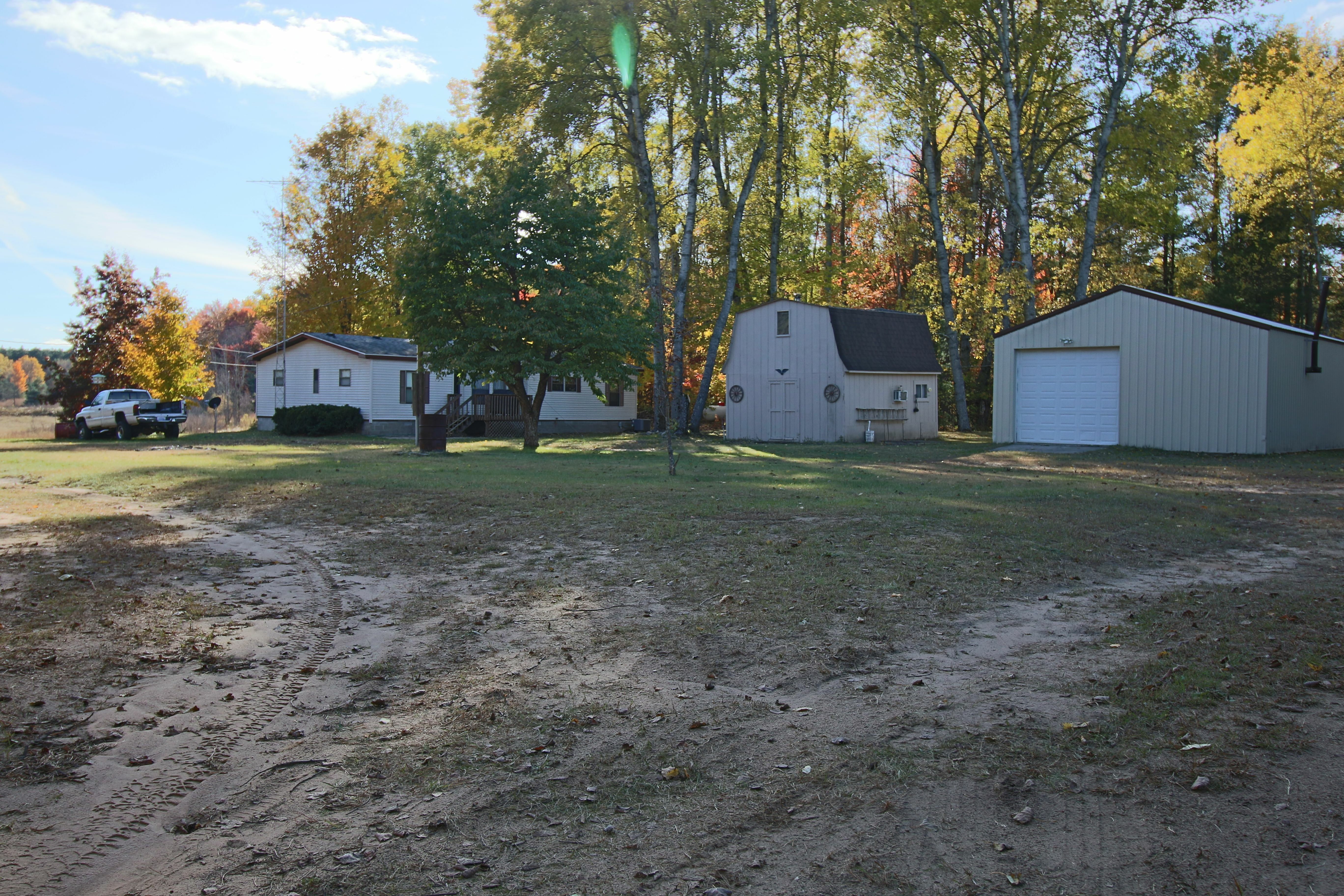 Property Photo:  23260 13 Mile Road  MI 49655 8543 