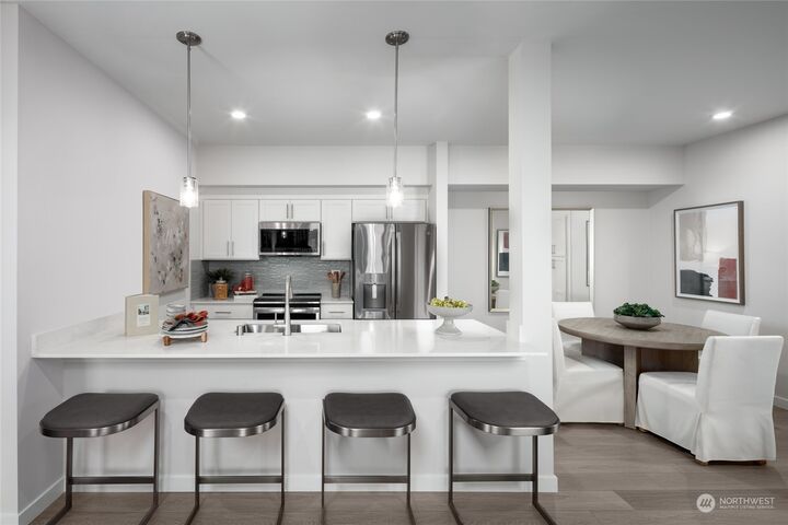 Property Photo: 1222 Confluence Way SE 202 WA 98045