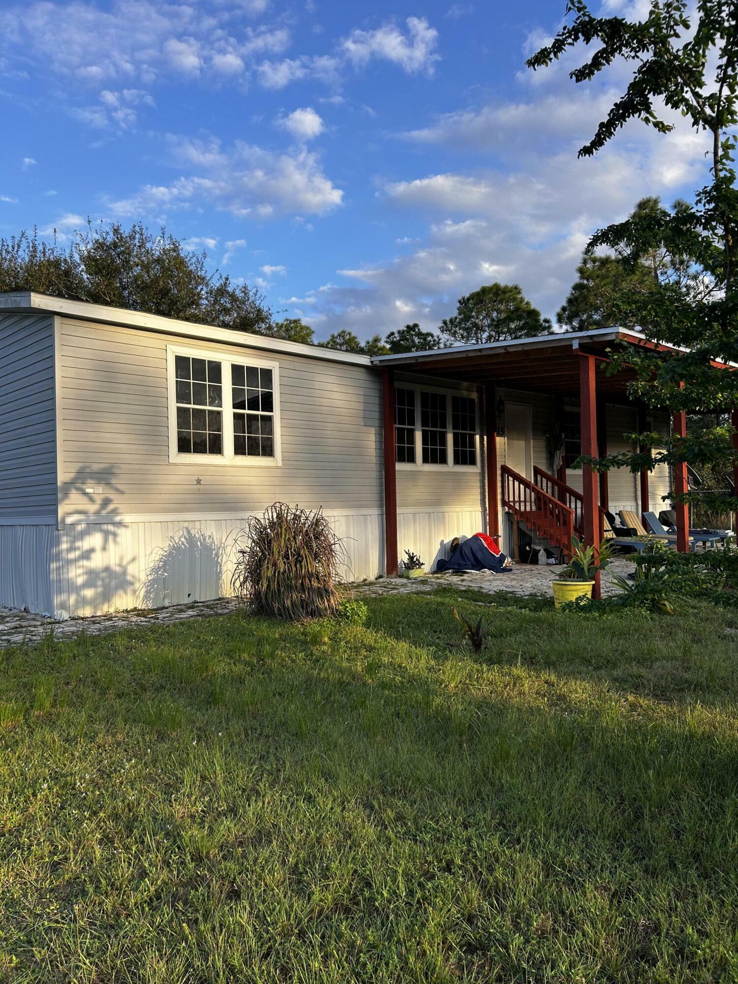 Property Photo:  115 W Marimba Circle  FL 33440 