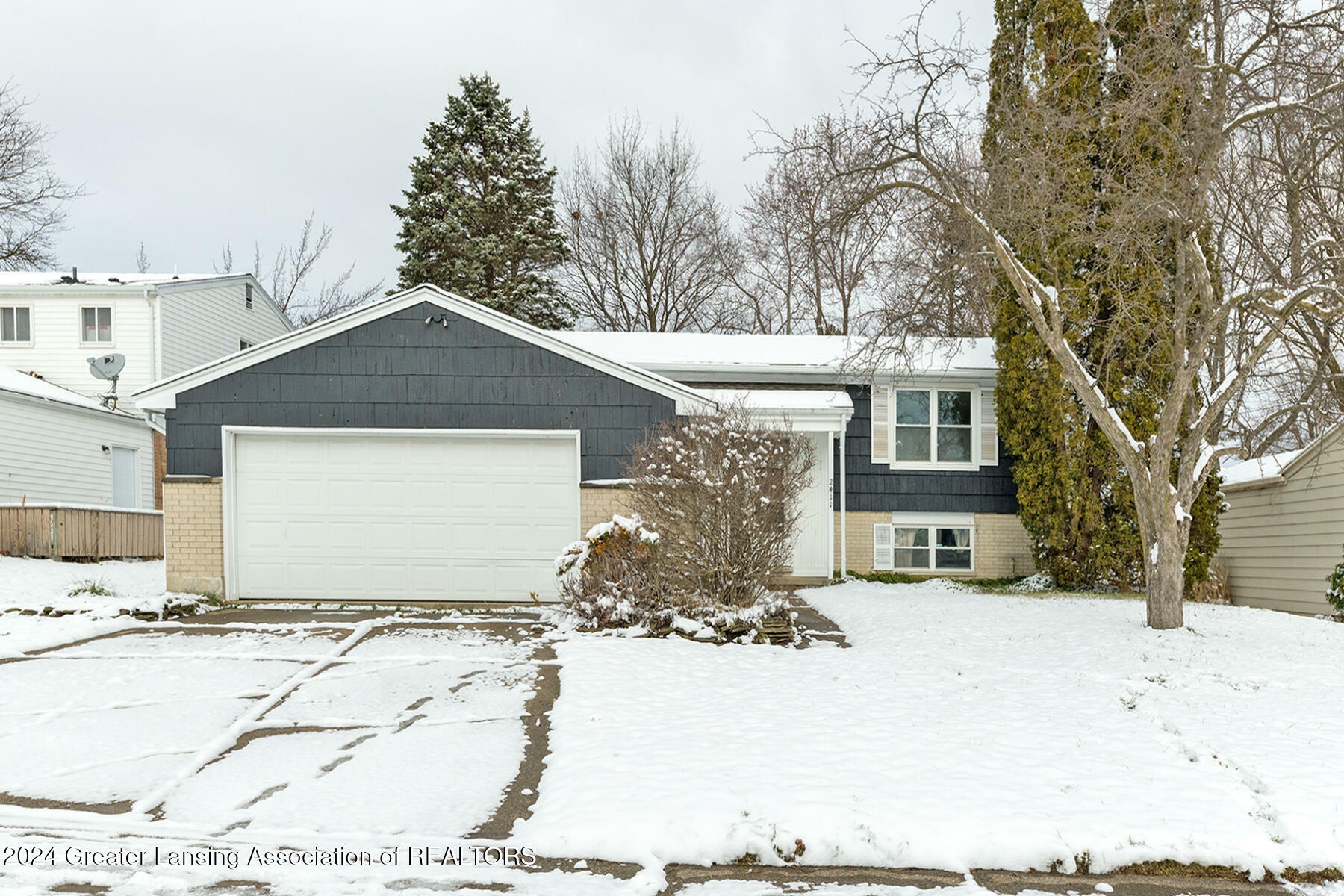 Property Photo:  2411 Lyman Drive  MI 48912 