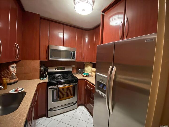 Property Photo: 18-05 215 Street 7 H NY 11360