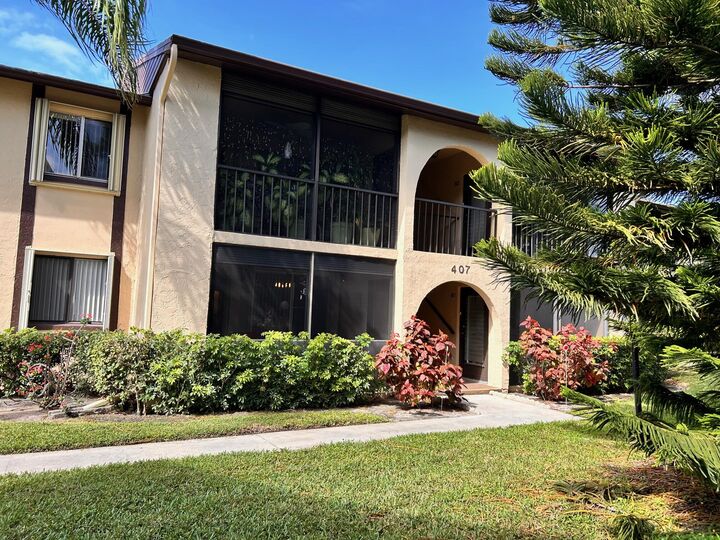 Property Photo:  407 Pine Glen Lane C-1  FL 33463 