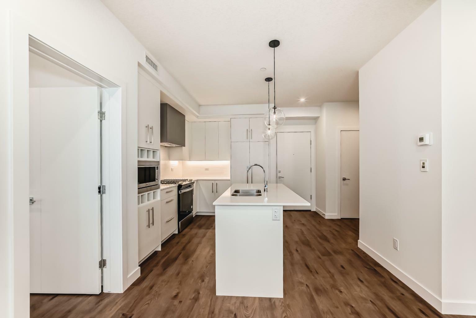 Property Photo: 8370 Broadcast Avenue SW 205 AB T3H 6L3