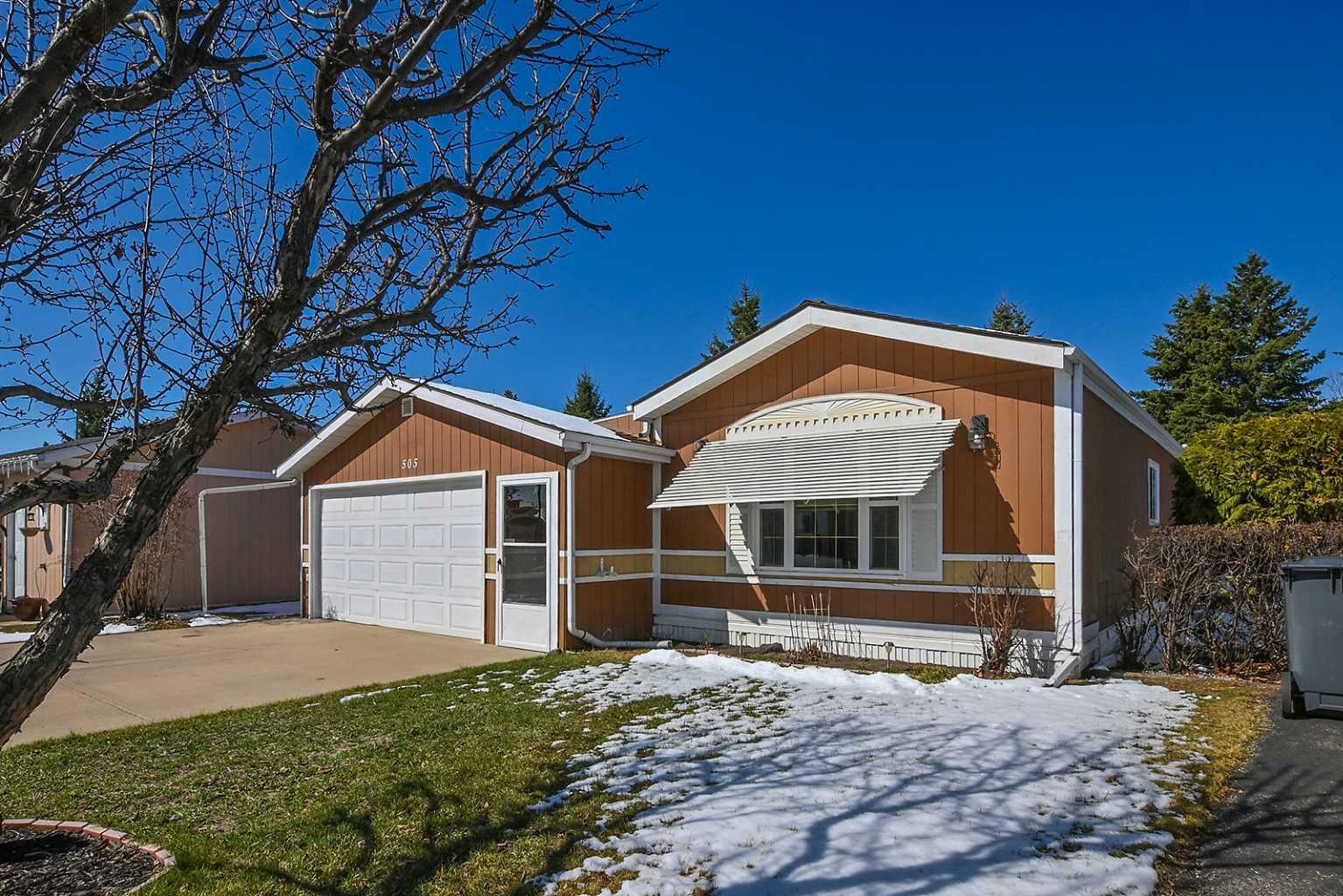 Property Photo: 37543 England Way 505 AB T4S 2C3