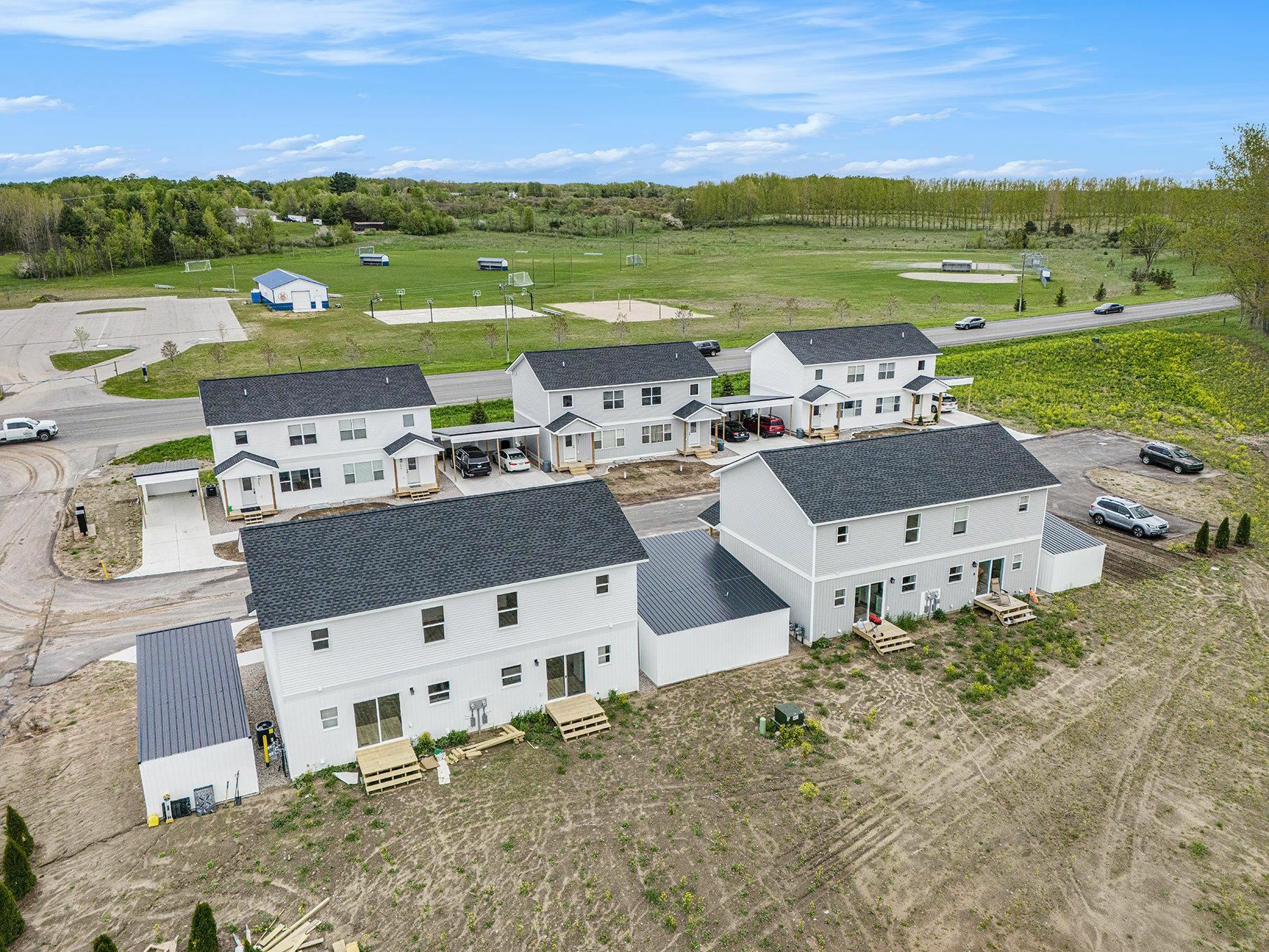 Property Photo:  202 Thrive Boulevard 15  MI 49696 