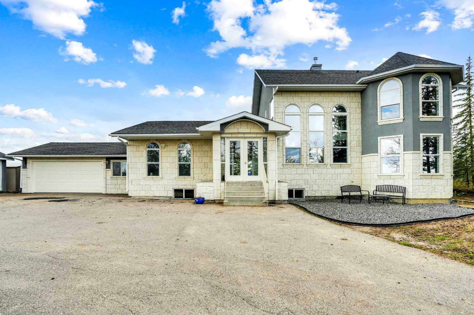 Property Photo: 24073 Burma Road AB T3R 1E3