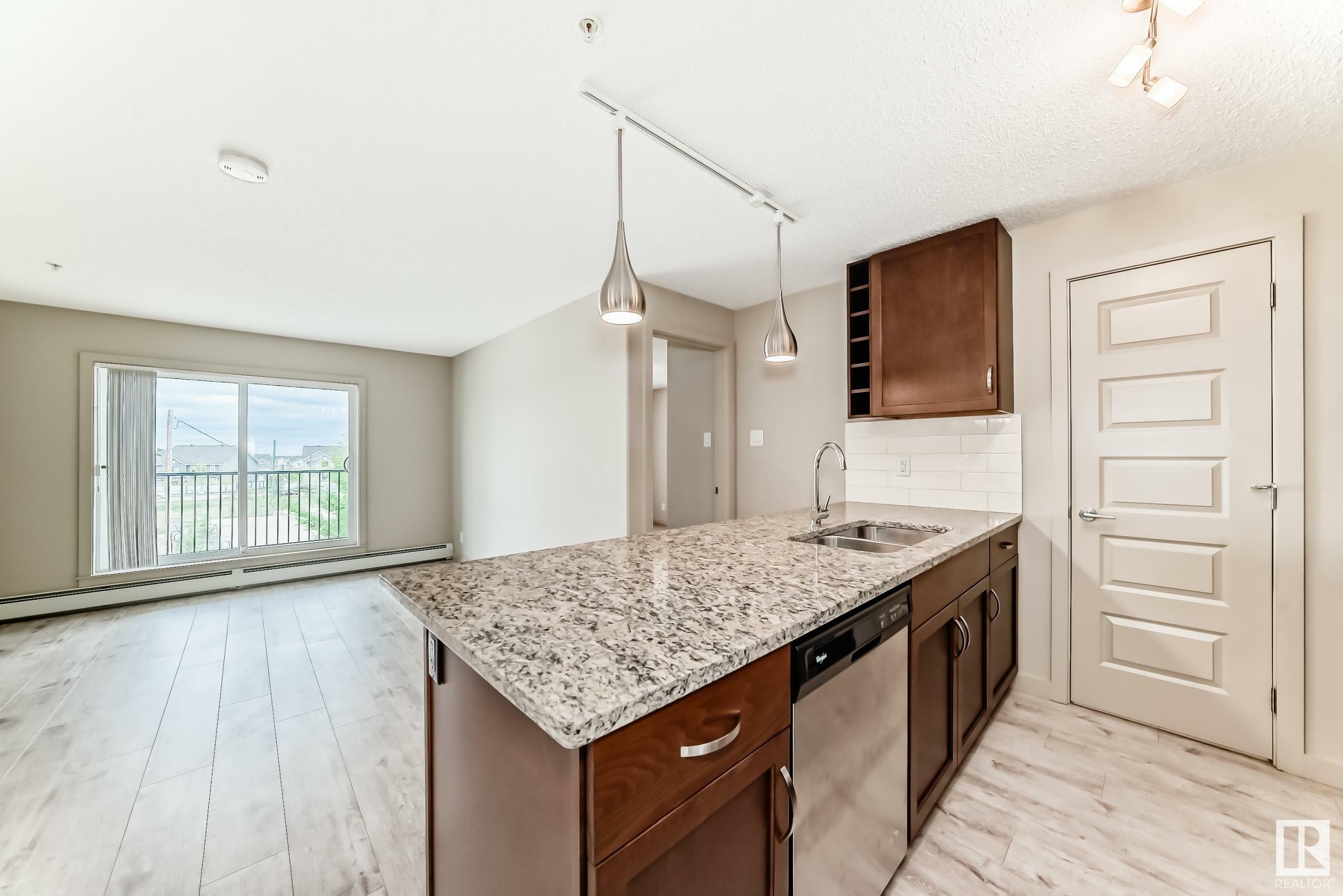 Property Photo: 4008 Savaryn Drive SW 318 AB T6X 2E5