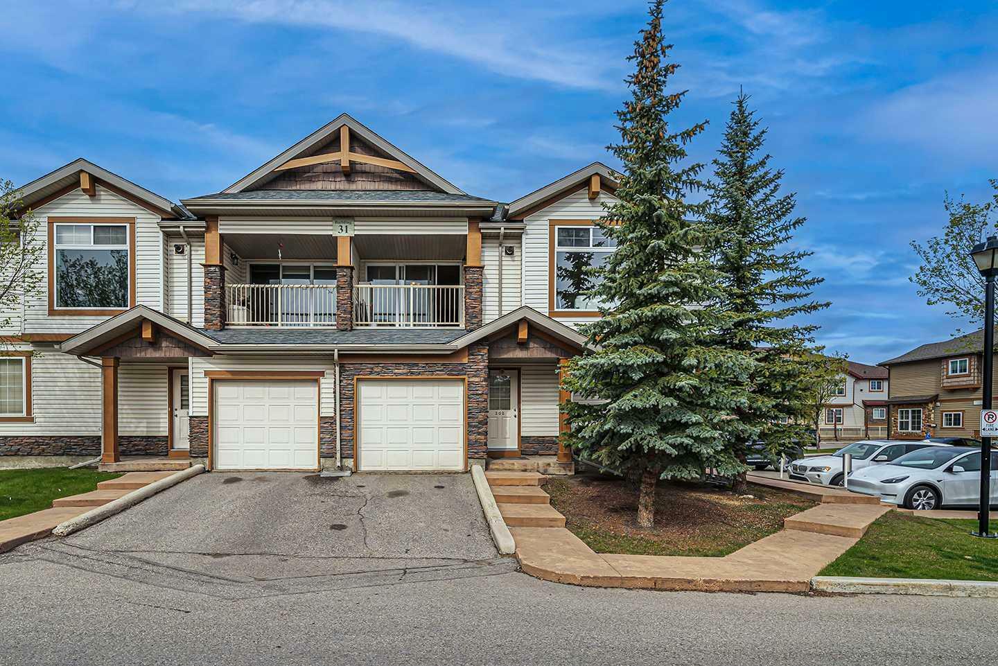 Property Photo: 31 Panatella Landing NW 202 AB T3K 0J7