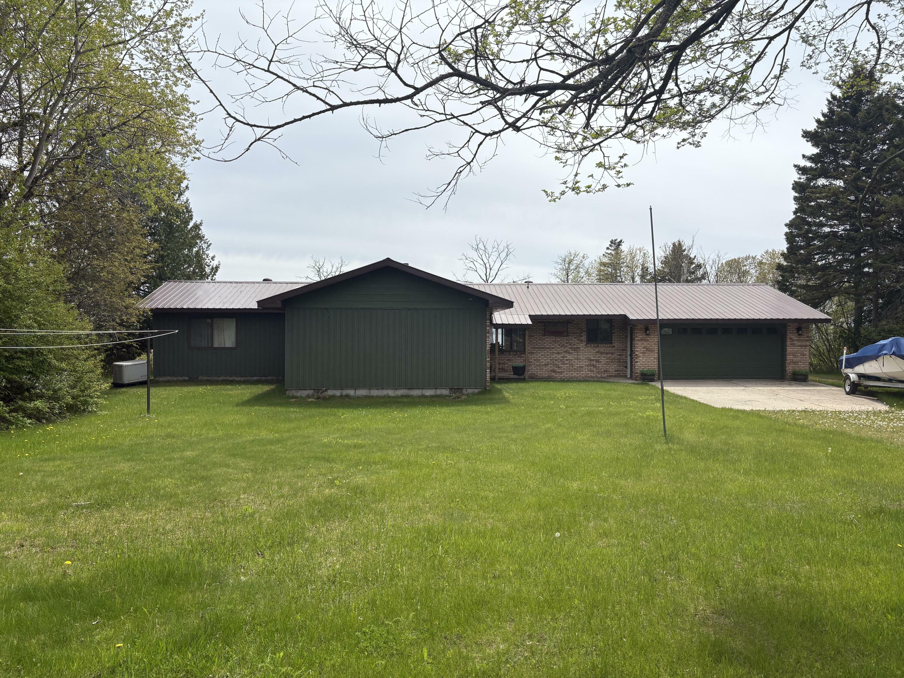 Property Photo: W11991 Middle Beach Rd MI 49762
