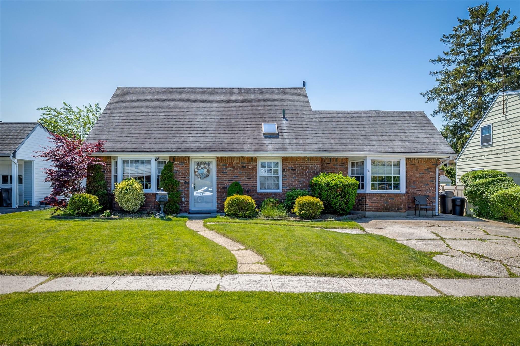 Property Photo: 98 Bluespruce Road NY 11756