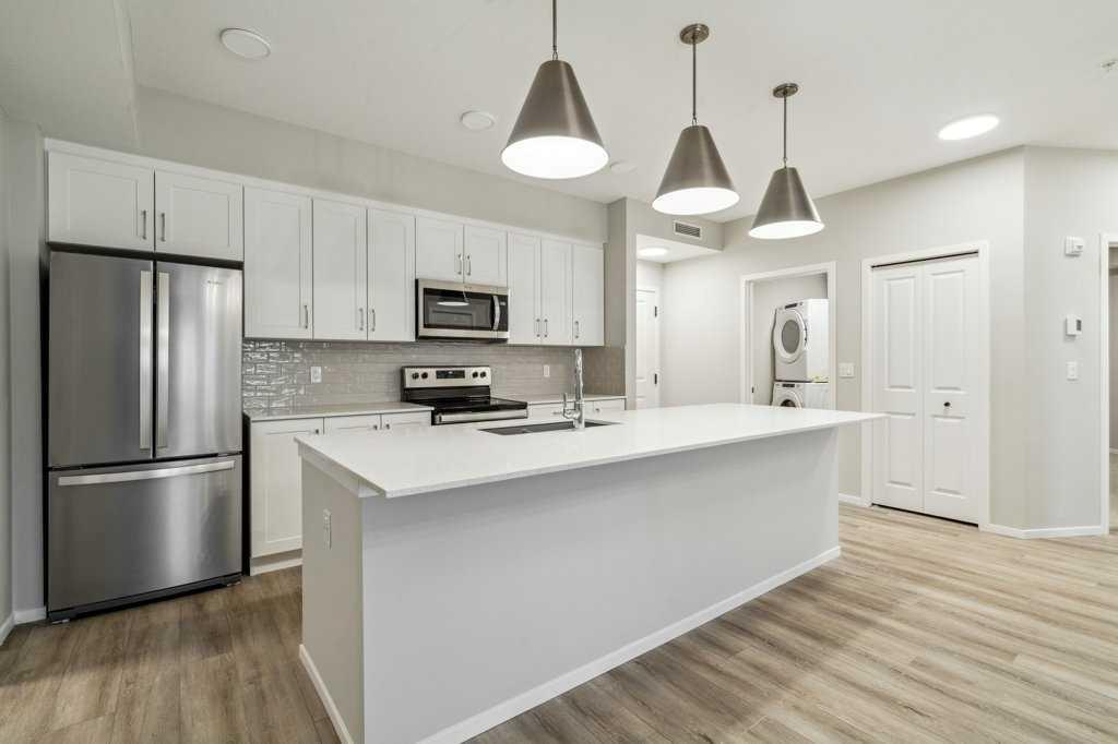 Property Photo: 140 Mahogany Street SE 306 AB T3M 4E1
