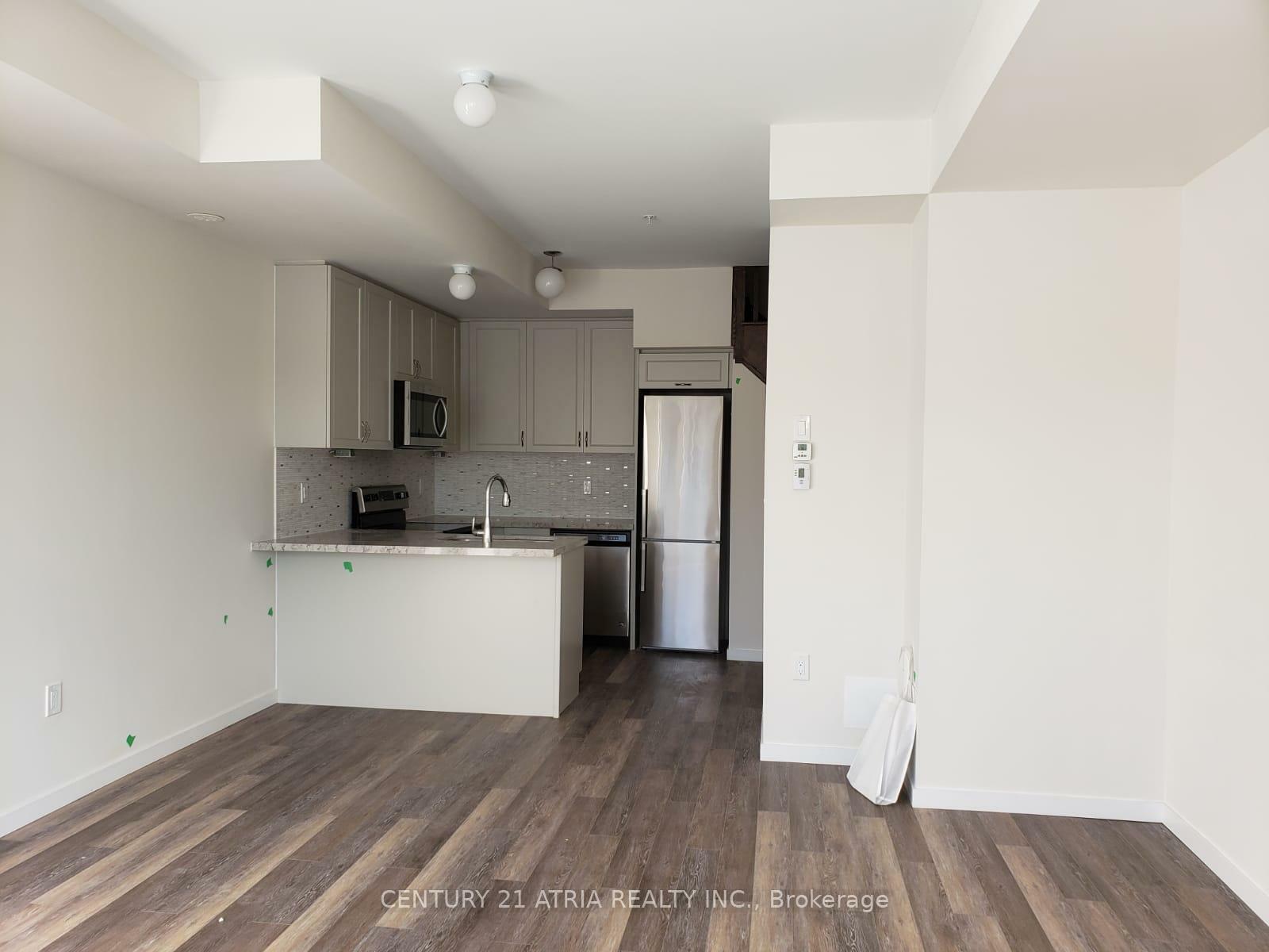 Property Photo: 1711 Pure Springs Boulevard 104 ON L1X 0E3