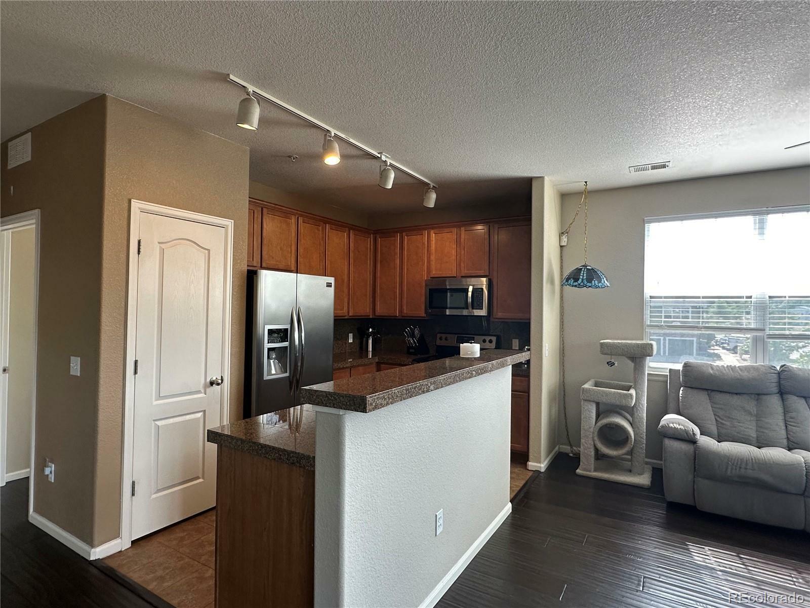 Property Photo:  7140 Simms Street 202  CO 80004 