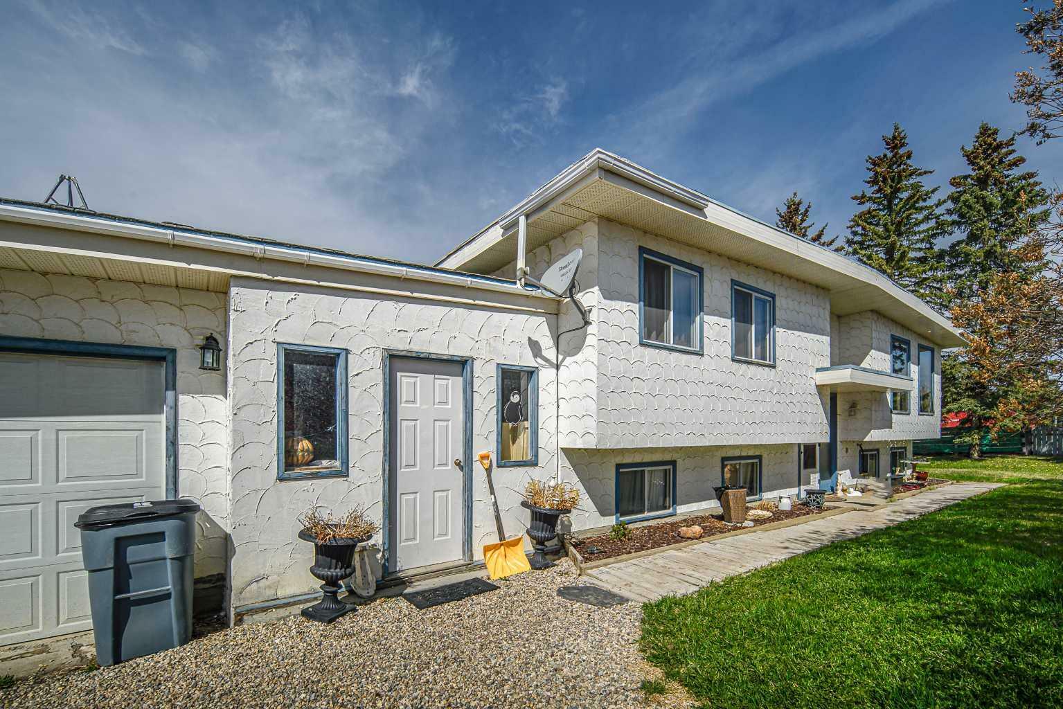 Property Photo: 262057 Poplar Hill Drive AB T3R 1C7