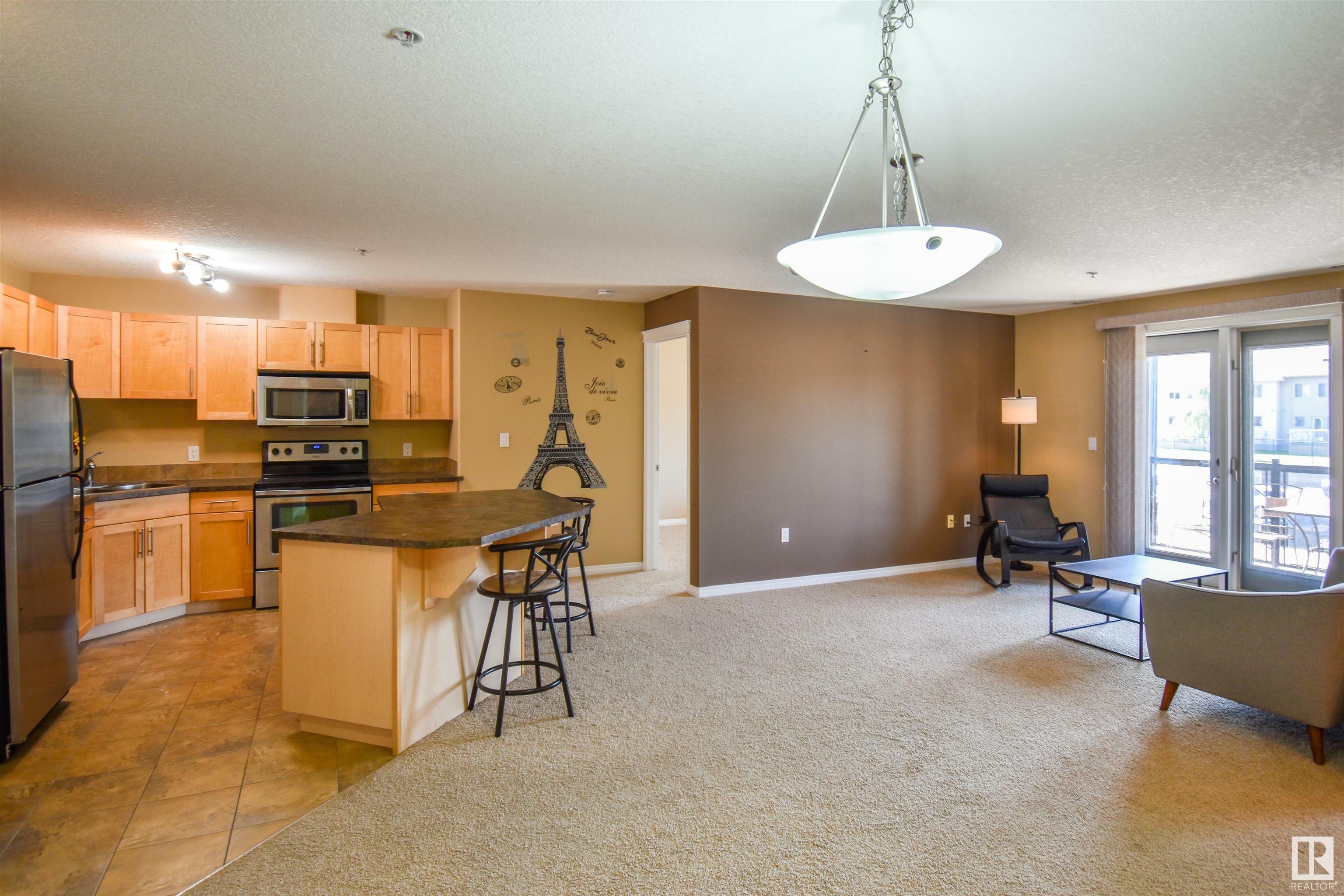 Property Photo: 300 Spruce Ridge Road 204 AB T7X 0H6