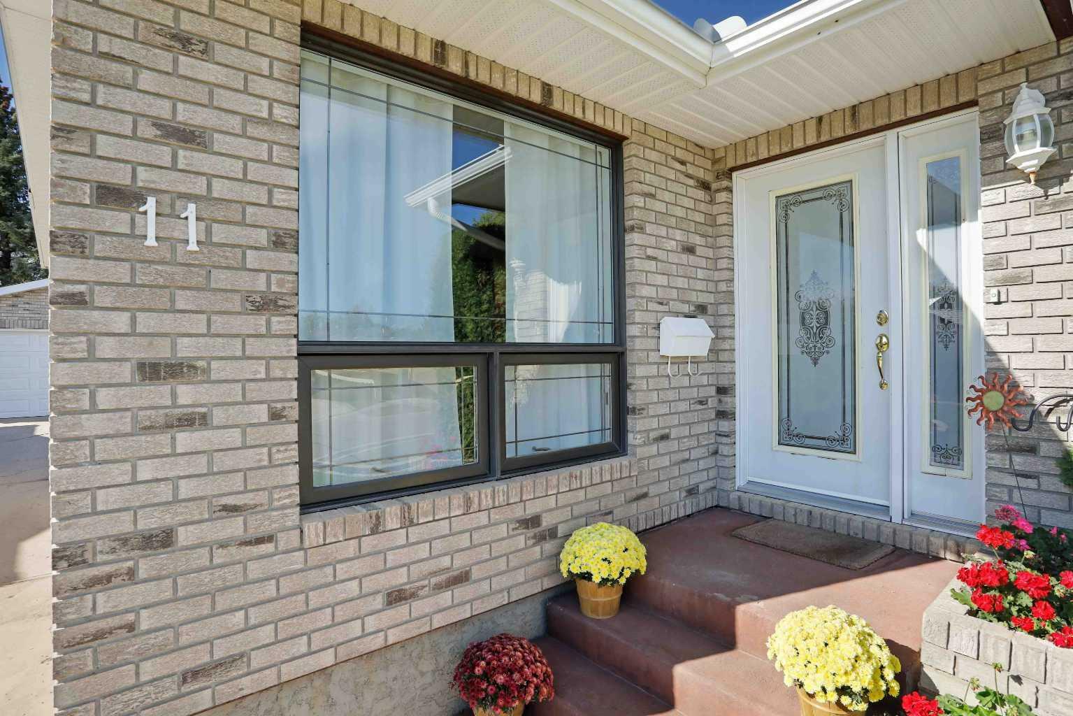 Property Photo: 11 Lakeview Crescent E AB T1R 0L9