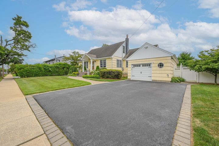 Property Photo: 276 N Utica Avenue NY 11758
