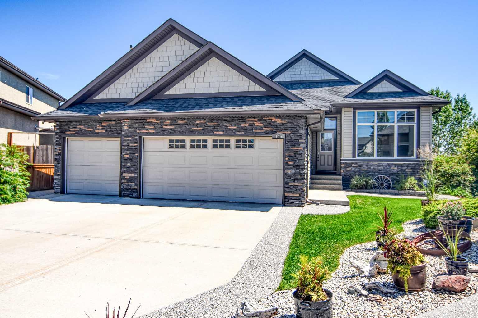 Property Photo: 145 Aspenmere Place AB T1X 0G4