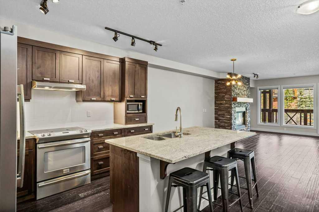 Property Photo: 106 Stewart Creek Landing 220 AB T1W 0G6