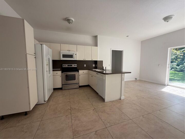 Property Photo:  13212 Old Biscayne Blvd 1903  FL 33033 