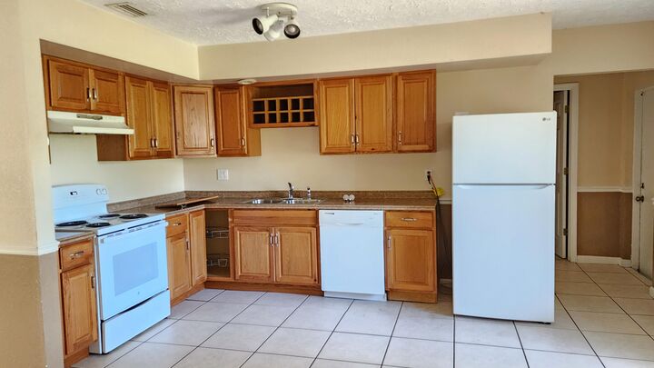 Property Photo:  342 NE Surrey Street  FL 34983 