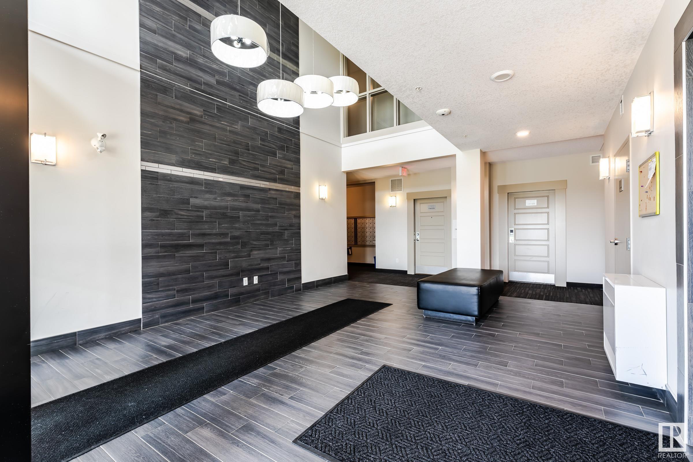 Property Photo: 320 Ambleside Link SW 408 AB T6W 2Z9