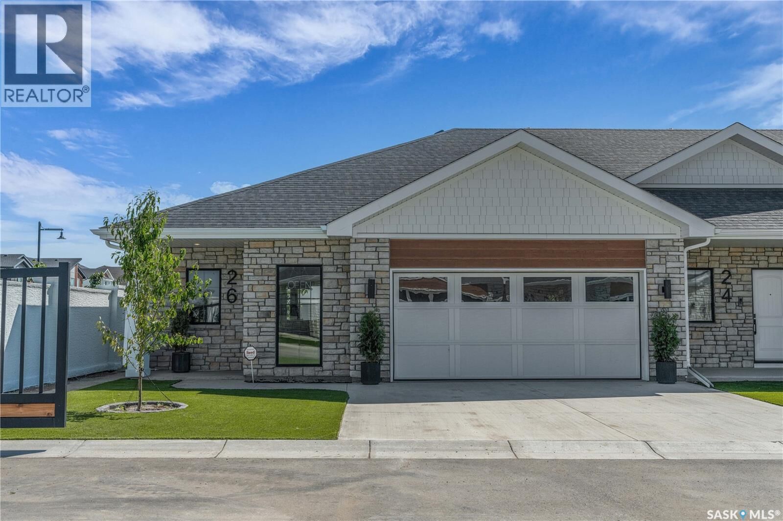 Property Photo:  4 720 Brighton Boulevard  SK S7V 1X1