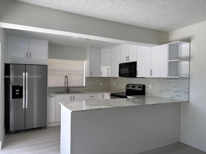 Property Photo: 6670 W 24th Ct 17-12 FL 33016