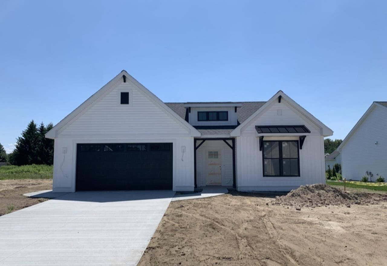 Property Photo:  113 Brass Leaf  MI 48642 