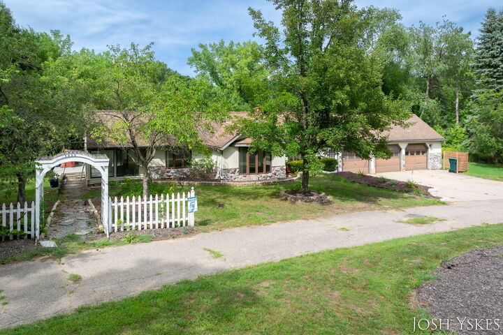 Property Photo: 5855 Grand River Drive NE MI 49301