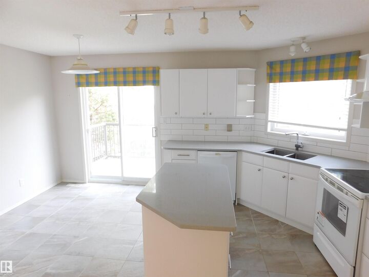 Property Photo:  1295 Carter Crest Road NW 26  AB T5R 2N6 