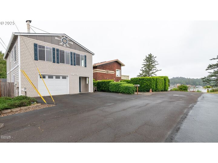Property Photo: 203 SE Surf Ave OR 97367